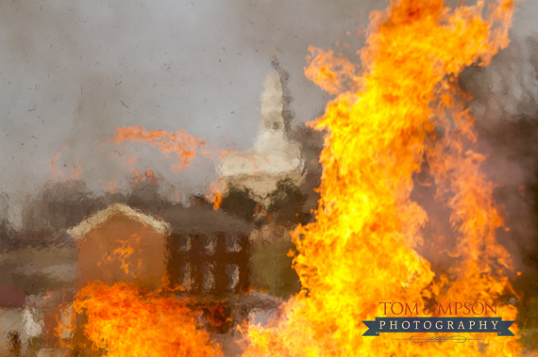 nauvoo temple seen through praire fire demonstration flames