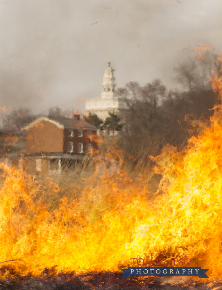 nauvoo temple seen through praire fire demonstration flames