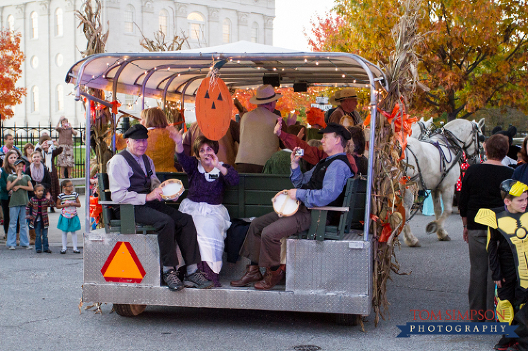 missionaries sing and play instruments in the nauvoo pumpkin walk parade