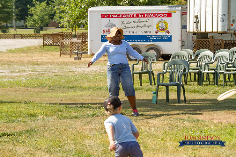 core cast practices and relaxes playing frisbee
