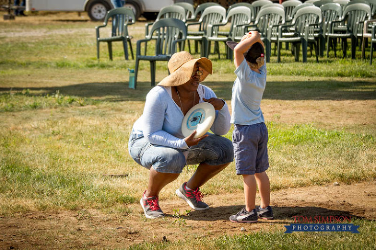 core cast plays games with kids on pageant grounds